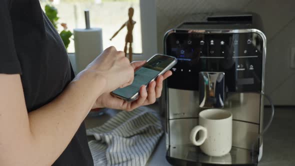 Woman Uses Smartphone App to Operate Coffee Machine, Food Stock Footage ...