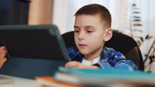 Boy Using Tablet for Education at Home
