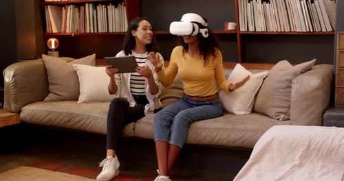Friends Try Virtual Reality Headset on the Couch