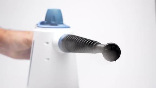 Steam Cleaner Emitting Vapor in Studio