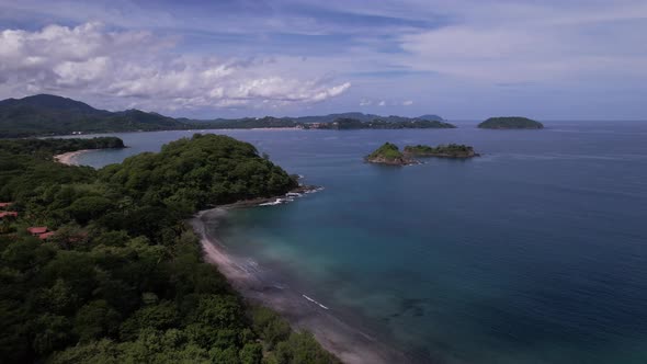 Explore the rugged beauty of coastal islets, where the relentless waves ...