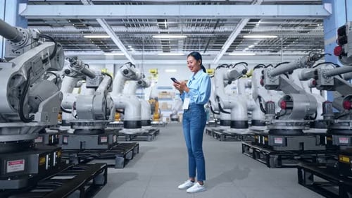 Asia Professional Female Works On Her Phone With Robotic Arms