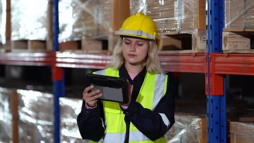 Warehouse workers checking the inventory.