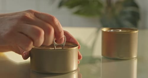 Opening a Can of Food on the Table