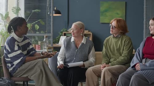 Group Meeting Talking Sitting in Circle Indoor Setting