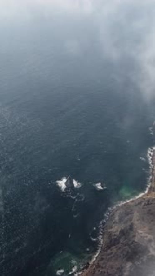 Aerial View on Calm Azure Sea and Volcanic Rocky Shores Small Waves on Water Surface Nature Summer