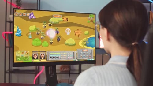 Woman Playing Cartoon Tower Defense Video Game