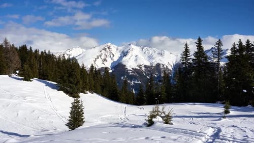 Idyllic winter snow timelapse in the mountains of the alps. View from the slopes of Rosskopf near St