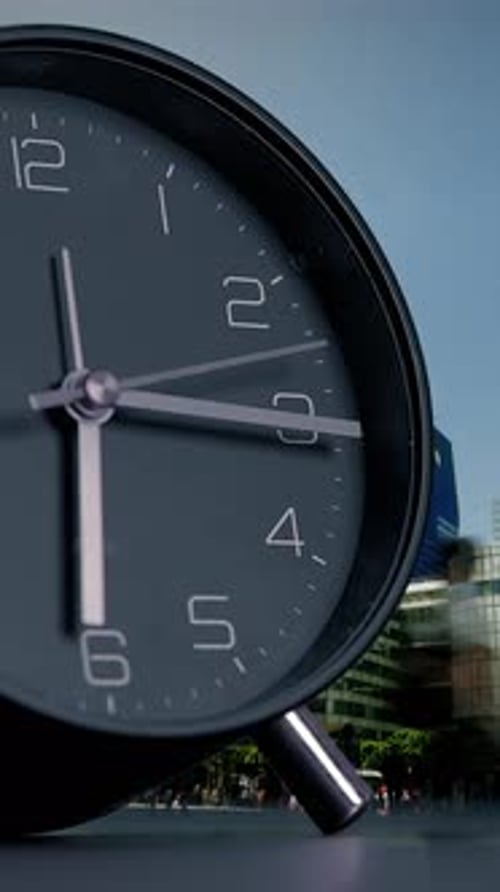 A Modern Black Clock Placed Against A Beautiful Cityscape Background For A Stunning View