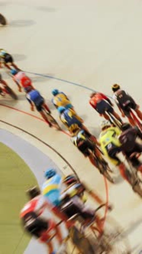 Pursuit track race on velodrome. Cyclists riding on cycling track.Vertical video