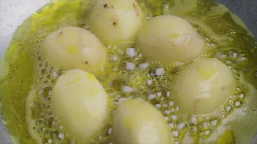 Potatoes Frying in Hot Oil Close Up