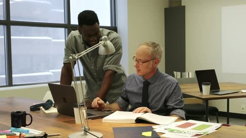 Businessmen Talking Working at Laptop in Office 3034 Years
