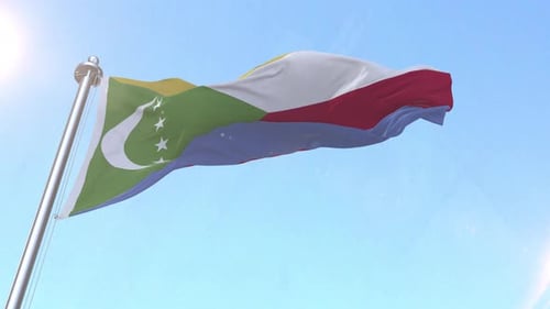 Realistic Comoros National Flag Waving against Clear Blue Sky