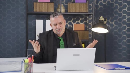 Professional Man Speaking on Video Conference in Office