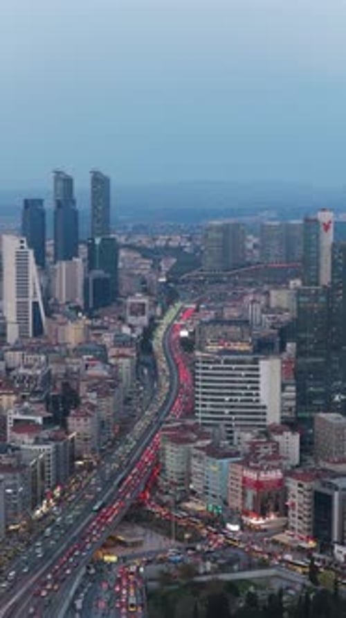 Vertical Video of Istanbul Urban Landscape Showcasing Skyscrapers and Busy Highway with Heavy