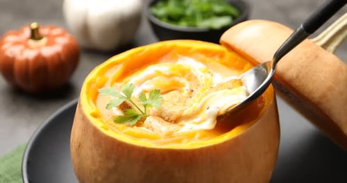 Creamy Pumpkin Soup Served in Pumpkin Bowl