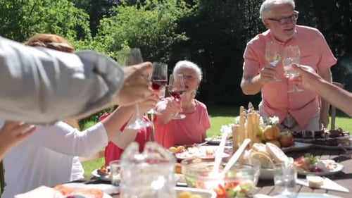 Family and friends toasting at outdoor garden party