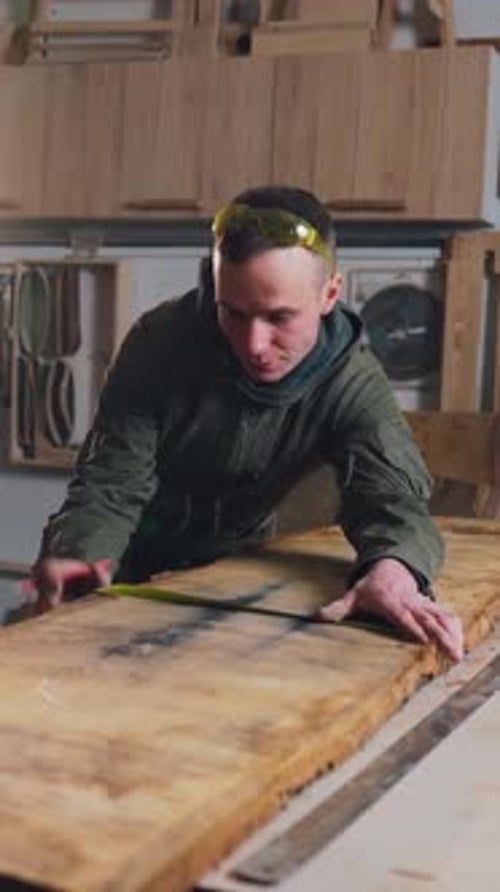 Wooden Furniture Production Carpenter Works in a Carpentry Shop Trims a Wooden Plank Hand Carpentry