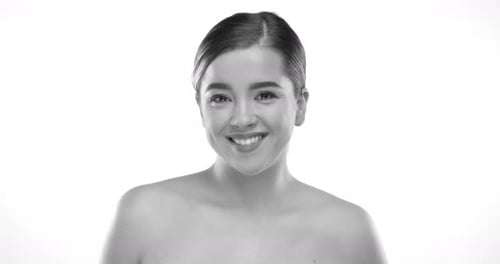 Smiling Young Woman Posing in Black and White