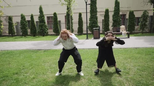 The Video Showcases Joyful Outdoor Dancing in a Vibrant Park