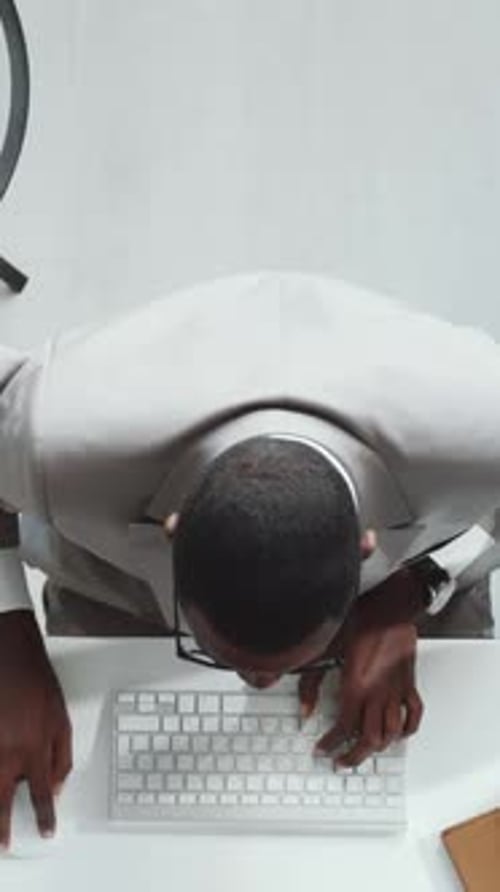 Manager Excitedly Shouting at Camera Celebrating Good Deal in Office