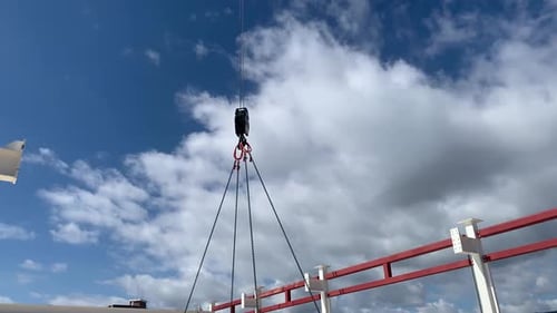 Construction Crane Lifting Heavy Load in Urban Setting