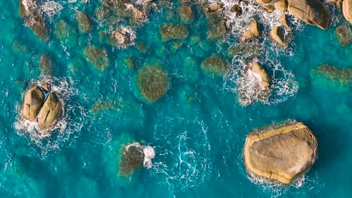 Blue ocean. Aerial view of waves and clifs.