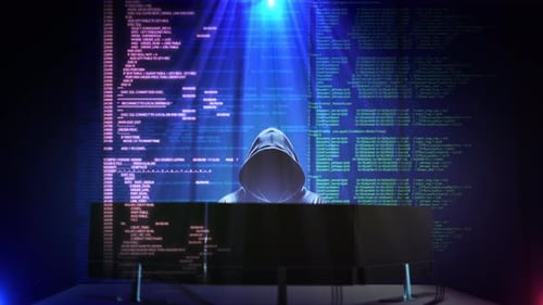 Hooded Hacker Behind Monitors with Scrolling Digital Code