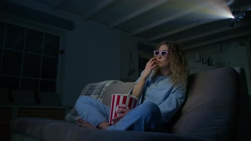 Woman Watches Movie with 3D Glasses and Popcorn
