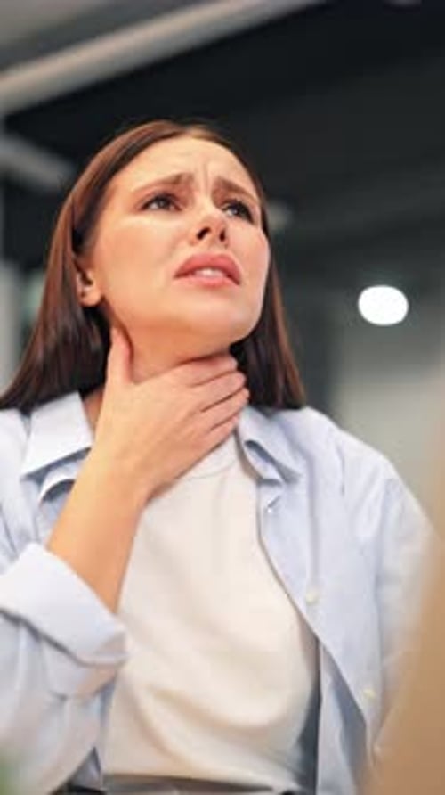 Woman with sore throat