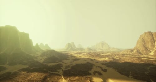 Expansive Desert Landscape with Towering Rock Formations at Dusk