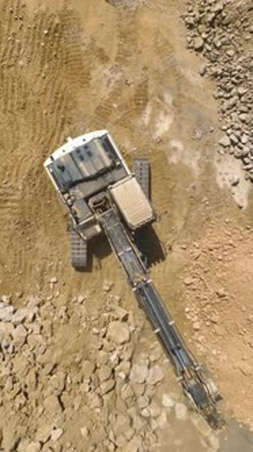 Ertical Video Land Transformation Aerial Gaze at Tractor Preparing Site for Housing Complex