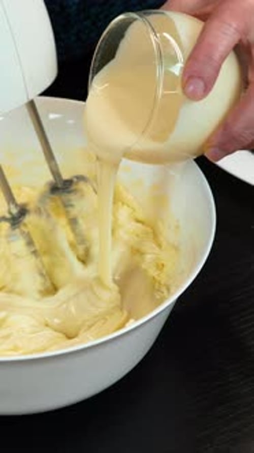 Making Cake Cream with Electric Mixer in Home