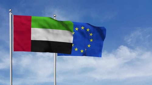 United Arab Emirates and European Union Flags Waving Together in Blue Sky