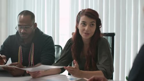 Diverse Group Meeting in Bright Office Conference Room