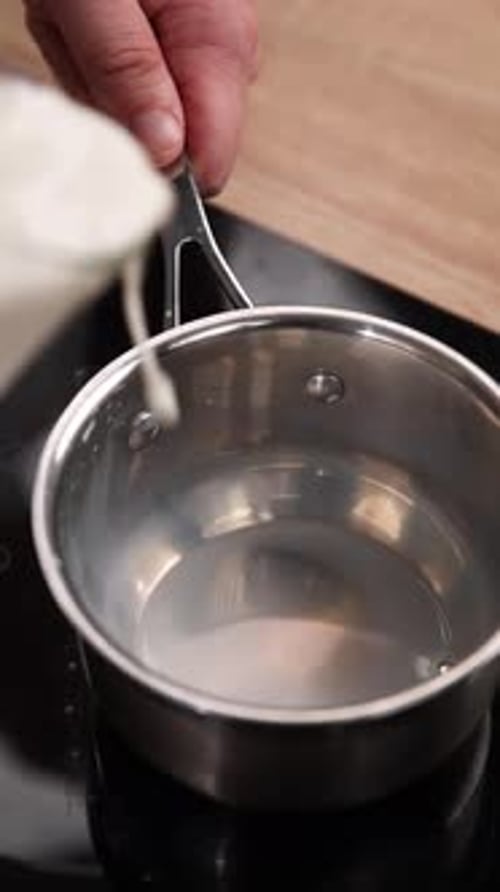 The chef is preparing milk. Close-up