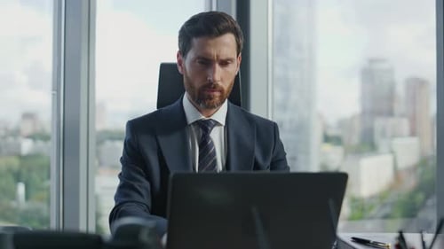 Portrait Focused Businessman Working at Office Using Laptop