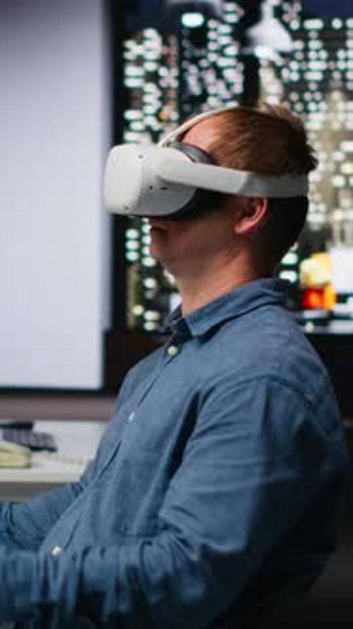 Vertical Video Professional Male Developer Operating VR Glasses to Create Spaceship Station