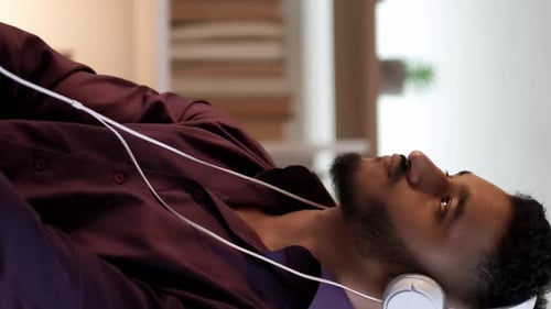 Young Adult Listening to Music with Headphones