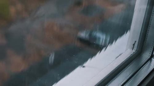 Rain on Window City View Slow Motion