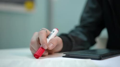 Closeup Male Hand Placing Marker at Notebook Tapping Fingers on Table