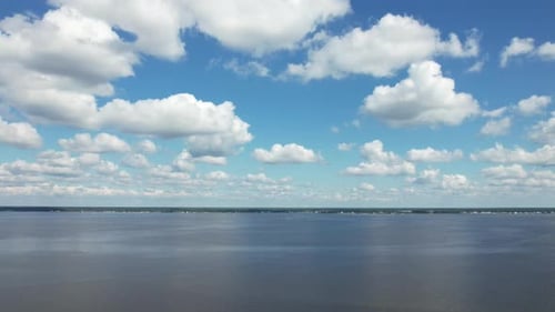 Aerial hyper lapse of clouds over the Bogue Sound in North Carolina, drone time lapse.
