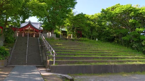 POV Slow motion walk across temple grounds in rural Japan