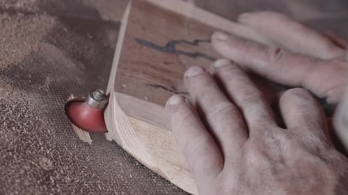 Woodworking Using Router in Workplace