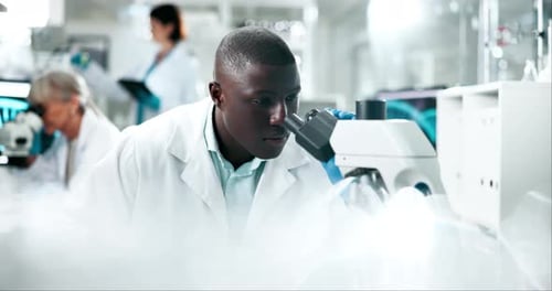Scientist Using Microscope in Modern Lab