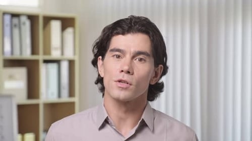 Young Male Entrepreneur Talking to Camera on Training at Office