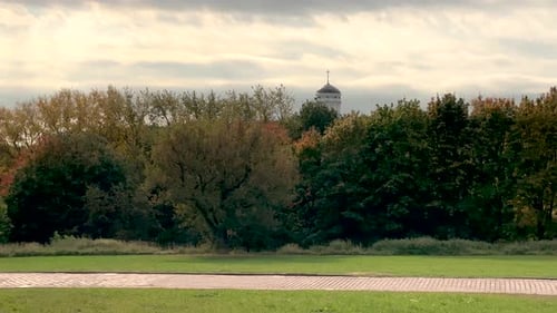 Peaceful Park View of Autumn Trees and Church
