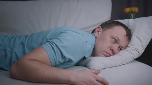 Man Sleeping Peacefully on Sofa in Home