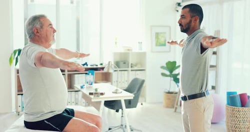 Senior Man Doing Arm Stretches in Physical Therapy