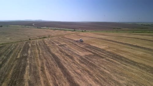 Tractor working on the field doing tillage with cultivator